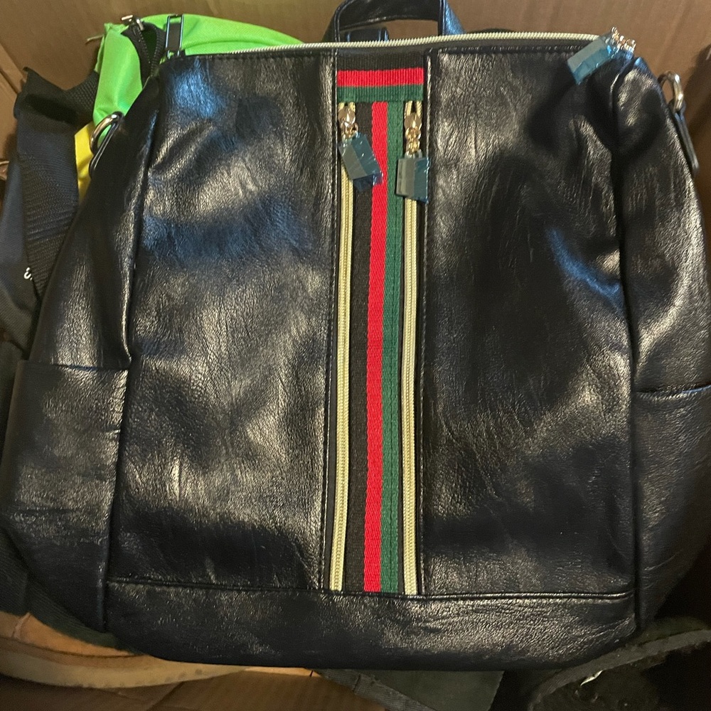 High fashion look, medium sized fake leather bag.